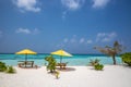 Amazing beach, yellow beach umbrella, blue sky, concept of paradise, perfect gateway vacation. Royalty Free Stock Photo