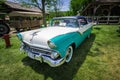 Amazing beautiful closeup front view of classic vintage retro car in outdoor park