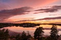 Amazing Beautiful sunset on the Baltic Sea. Bright golden orange pink purple tones of the sunset sky. Rocky Islands of Stockholm