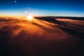 Amazing and beautiful sunset above the clouds with dramatic clouds Royalty Free Stock Photo