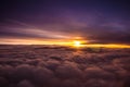 Amazing and beautiful sunset above the clouds with dramatic clouds