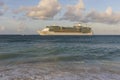 Amazing beauty  Atlantic ocean turquoise water surface. Big cruise boat merging with blue sky and white clouds. Royalty Free Stock Photo