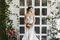 Amazing beauty, busty brunette, model girl with diadem on her head and in a wedding lace dress Royalty Free Stock Photo