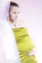 Amazing beauty pregnant woman behind curtain