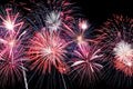 Amazing blue, white and red fireworks on dark background Royalty Free Stock Photo