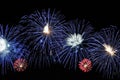 Amazing blue, white and red fireworks on dark background Royalty Free Stock Photo