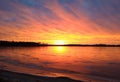 Amazing Bright Colorful Sunset Over Clear Frozen Icy Summit Lake in Winter in Northern Wisconsin`s Northwoods Royalty Free Stock Photo