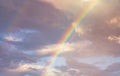 amazing bright rainbow in beautiful evening cloudy sky after rain and thunder, weather concept Royalty Free Stock Photo