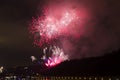 Amazing bright red and pink firework celebration of the new year 2015 in Prague with the historic city in the background Royalty Free Stock Photo