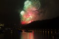 Amazing bright red,yellow,green firework celebration of the new year 2015 in Prague with the historic city in the background Royalty Free Stock Photo