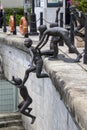 Amazing bronze statues by Chong Fah Cheong of children jumping into the Singapore River