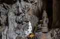 Amazing buddha statues in beautiful cave, holy natural buddhist sanctuary in Thailand Royalty Free Stock Photo