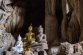 Amazing buddha statues in beautiful cave, holy natural buddhist sanctuary in Thailand Royalty Free Stock Photo