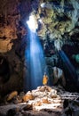 Amazing Buddhism with the ray of light in the cave, Ratchaburi P Royalty Free Stock Photo