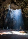 Amazing Buddhism with the ray of light in the cave, Ratchaburi P Royalty Free Stock Photo