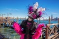 Amazing carnival mask against gondolas in Venice, Italy Royalty Free Stock Photo