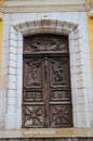 Amazing carved door of Church of the Immaculate Conception in Antibes, France Royalty Free Stock Photo