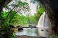 Amazing cave in deep forest with beautiful waterfalls background at Haew Suwat Waterfall in Khao Yai National Park, Thailand