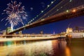 Amazing celebration fireworks New York City Brooklyn bridge and Manhattan skyline night Hudson River Royalty Free Stock Photo