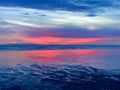 Amazing cherry red sunset and reflection on the beach Royalty Free Stock Photo