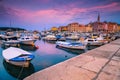 Anchored boats in the harbor of Rovinj at dawn, Croatia