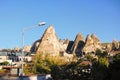 Amazing cityscape of ancient Goreme city in Cappadocia, Turkey. Old cave houses coexist with typical houses