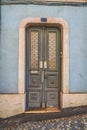 Amazing classic gray wooden door with decorative details. Front view Royalty Free Stock Photo