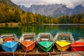 Amazing clear mountain lake in forest among fir trees in sunshine. Bright scenery with beautiful turquoise lake against the