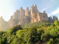 Amazing cliffs on Mountain Montserrat in Catalonia Spain lightened by sunbeams. Beautiful mountain landscape on a sunny summer