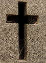 Amazing close-up of a cross carved granite tombstone with spider webs on it