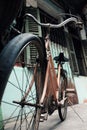 Amazing close up old bicycle front of antique house in vintage tone Royalty Free Stock Photo