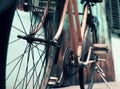 Amazing close up old bicycle front of antique house in vintage tone Royalty Free Stock Photo