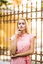 Amazing close up sunny sensual portrait of stunning elegant glamour woman, posing at Europe street, sunny evening colors. Royalty Free Stock Photo