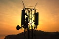 Amazing closeup sunset drone view of silhouette of cell tower. Wireless connection. Spectacular view of cellular tower with Royalty Free Stock Photo