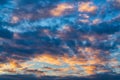 Amazing clouds in blue sky, illuminated by rays of sun at sunset to change weather. Colorful abstract meteorology Royalty Free Stock Photo