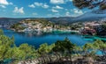 Amazing coastline with colorful houses under sunlight. Wonderful summer seascape with perfect blue sky of Ionian Sea Royalty Free Stock Photo