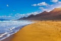 Amazing Cofete beach with endless horizon. Volcanic hills in the background and Atlantic Ocean. Cofete beach, Fuerteventura,