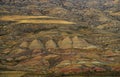 Amazing rocky desert on Georgia Azerbaijan border. Yellow brown red earth rock material covering hills. View from top Royalty Free Stock Photo