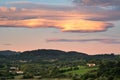 Amazing colorful lenticular clouds over village in countryside. Irun, Basque Country, Spain. Royalty Free Stock Photo