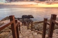 Amazing colorful sunrise over the sea, rocks and stone stairs, scenic seascape, Cavo Greko, Ayia Napa, Cyprus Royalty Free Stock Photo