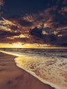 Beatiful sunset with clouds over sea and beach Royalty Free Stock Photo