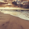 Beatiful sunset with clouds over sea and beach Royalty Free Stock Photo