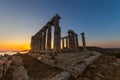 Amazing colorful sunset at the Temple of Poseidon, archaeological site of Sounion, Attica. Cape Sounion, Lavrio, Greece. A sunset Royalty Free Stock Photo