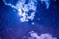 Amazing dark night sky with many stars, bright full moon and cloudy. Royalty Free Stock Photo