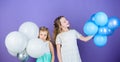 An amazing day with full of fun. Little girls celebrating birthday anniversary with air balloons. Adorable kids enjoy Royalty Free Stock Photo