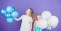 An amazing day with full of fun. Little girls celebrating birthday anniversary with air balloons. Adorable kids enjoy Royalty Free Stock Photo