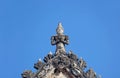 Amazing Deity Sculpture on the Pediment Top of the Old Ordination Hall of Wat Chomphuwek Buddhist Temple, Thailand Royalty Free Stock Photo