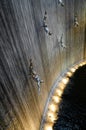 Amazing detail of waterfall in Dubai shopping center. Beautiful perspective of human diver sculptures