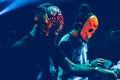 Amazing Djs with mask playing mixing music at Summer Party Festival. Royalty Free Stock Photo