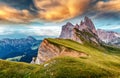 Amazing Dolomites Mountains Landscape during sunset. View of Seceda During Colorful Sunset. Picturesque Sky over the Odle Group